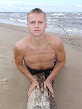 Jacked-up blonde twink doing push-ups outdoors