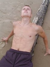 Jacked-up blonde twink doing push-ups outdoors