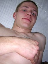 Buzzcut-sporting twink stroking his meaty dick