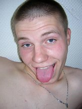 Buzzcut-sporting twink stroking his meaty dick