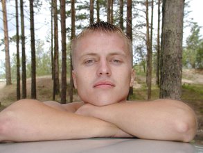 Blond-haired twink posing totally naked in the grass