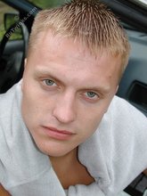 Blond-haired twink posing totally naked in the grass