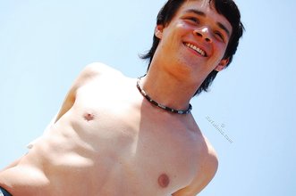 White t-shirt twink posing seductively outdoors