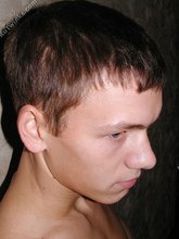 Good-looking teen boy shows his soft cock up close