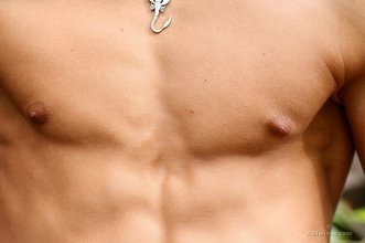 Muscular stud flashing his uncut cock outdoors