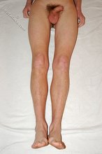 Slender twink with sexy feet shows off his ass as well