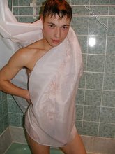 Athletic twink shows his hairy cock in the shower