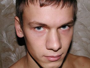 Tanned twink posing and looking incredibly menacing on cam