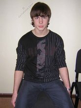 Long-haired twink shows off his shirtless body for you