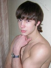 Long-haired twink shows off his shirtless body for you