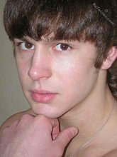Long-haired twink shows off his shirtless body for you