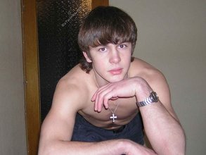 Long-haired twink shows off his shirtless body for you