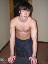 Long-haired twink shows off his shirtless body for you