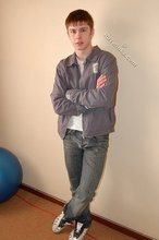 Long-haired twink shows off his shirtless body for you