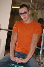 Cool shades twink posing shirtless in his gym