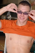 Orange t-shirt stud decides to pose seductively