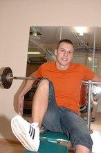 Orange t-shirt stud decides to pose seductively