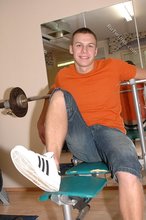 Orange t-shirt stud decides to pose seductively