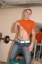 Orange t-shirt stud decides to pose seductively