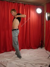 Slim blond-haired twink takes his sexy shirt off