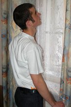 Soulful young boy posing shirtless on camera