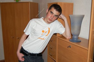 Soulful young boy posing shirtless on camera