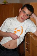 Soulful young boy posing shirtless on camera