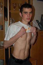 Soulful young boy posing shirtless on camera