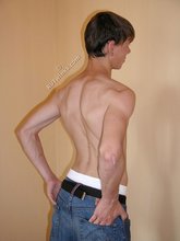 Dark-haired beauty posing in his tighty whities