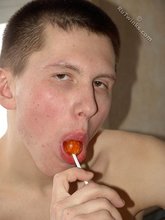 Lollipop-loving young boy showing off his booty