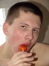 Lollipop-loving young boy showing off his booty