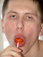 Lollipop-loving young boy showing off his booty