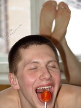 Lollipop-loving young boy showing off his booty