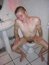 Smiling twink posing nude on the toilet (HQ gay XXX)