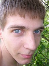 Blue-eyed twink nudist shows his cock in the forest
