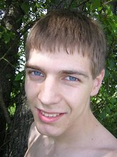 Blue-eyed twink nudist shows his cock in the forest
