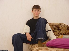 Horny young boy shows his feet and teases with his bulge