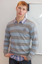 Blond-haired twink boy takes off his sexy sneakers and socks
