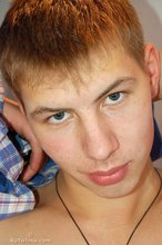 Dude with big ears blows a suitably big load on his belly