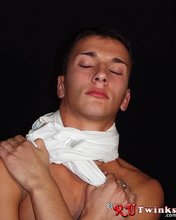 Young blue-eyed beauty showing his perfect body in a hot gallery