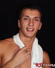 Young blue-eyed beauty showing his perfect body in a hot gallery