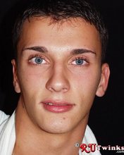 Young blue-eyed beauty showing his perfect body in a hot gallery