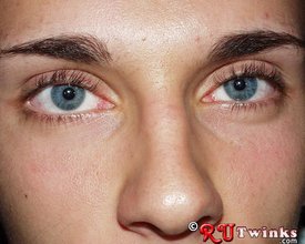 Young blue-eyed beauty showing his perfect body in a hot gallery