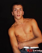 Young blue-eyed beauty showing his perfect body in a hot gallery