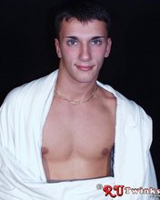 Dark-haired guy with a great-looking cock shows off his perfect bod