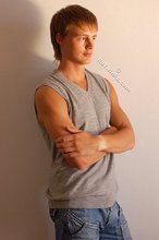 Blond-haired guy showing his armpits and muscular arms