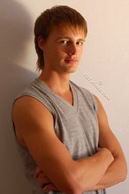 Blond-haired guy showing his armpits and muscular arms