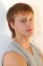 Blond-haired guy showing his armpits and muscular arms