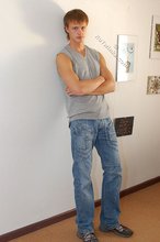 Blond-haired guy showing his armpits and muscular arms