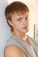 Blond-haired guy showing his armpits and muscular arms